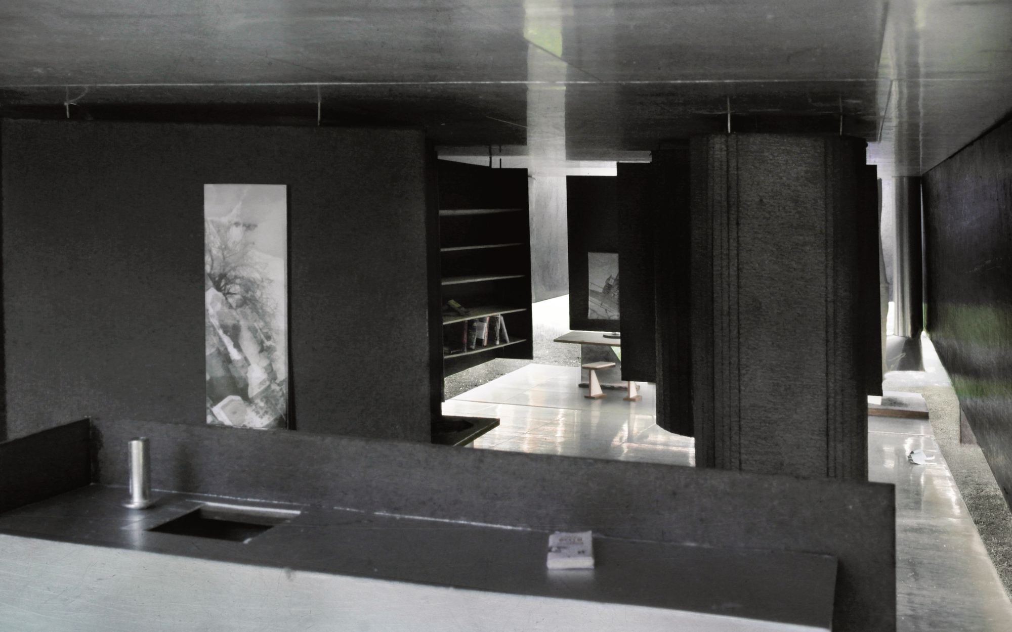 Model photograph of a dark hall with massive columns